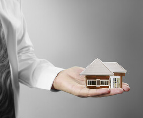 Home insurance concept in hand