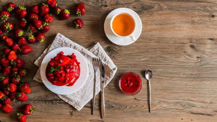 Top view strawberry diet on a breakfast with tea.