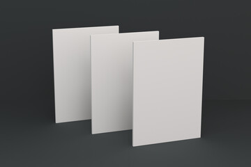 Three blank white closed brochure mock-up on black background
