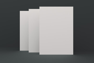 Three blank white closed brochure mock-up on black background