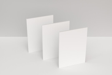 Three blank white closed brochure mock-up on white background