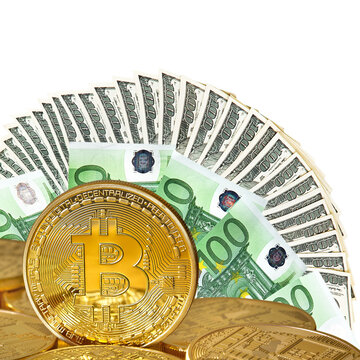 Golden Bitcoins close-up on a white background .Euro and dollars currency as a background. Photo (new virtual money ) .Conceptual photo. 