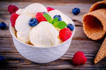 Homemade vanilla ice cream with raspberries and blueberries