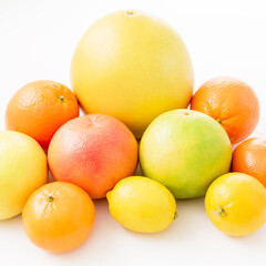 Summer mix of citrus fruits on white background. Flat lay, top view.