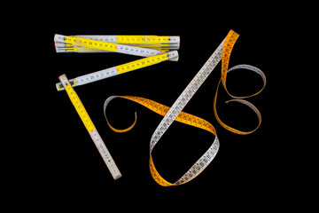 Meter and centimeter on black background