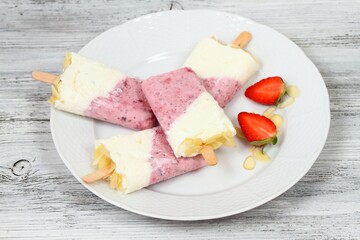 Homemade ice lolly from strawberries, cottage cheese & almond 