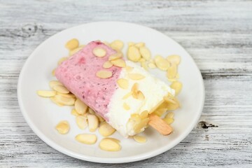 Homemade ice lolly from strawberries, cottage cheese & almond 