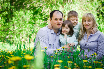 Family portrait in a spring park.