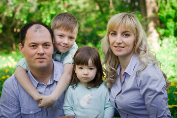 Fototapeta na wymiar Family portrait in a spring park.