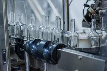 Wine bottles on the machine in production