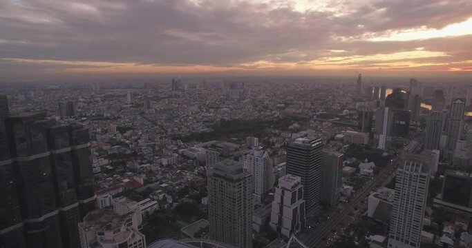 Bangkok Skyline and Chao Phraya River at Sunset, Aerial Drone Footage
