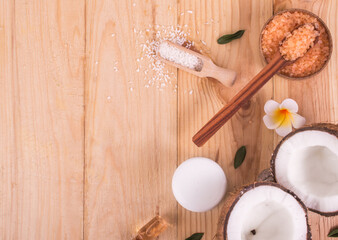 Coconut and oil on wooden table .Organic and healthy food concept. Beauty and SPA treatment product.