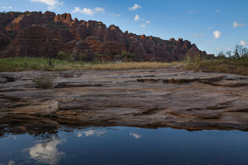 Fototapeta na wymiar Reflections of the domes in the creek leading from Cathedral Gorge in the Bungle Bungles, Purnululu World Heritage Listed National Park, Western Australia during the Wet Season.