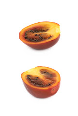 Half of a ripe tamarillo fruit isolated