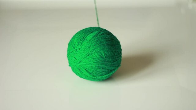 Taking thread from a yarn ball