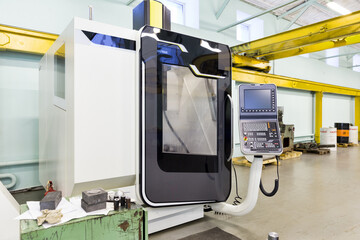 Vertical machining center 3 axis universal milling. Industrial equipment of cnc milling machine center in tool manufacture workshop