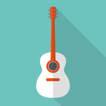 Picture of a guitar with a white body on a green background
