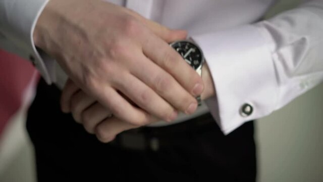 Man wears wrist watches closeup