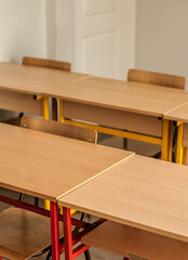 Chairs and tables inside empty classroom in primary school