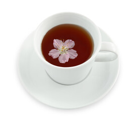Tea in a cup with cherry flower