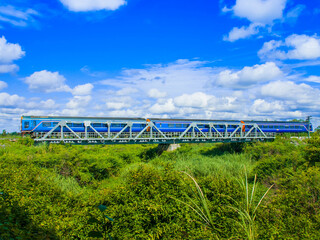 Diesel railcar set was passing steel bridge, 2016. (Taken form public road.)