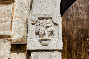 Solopaca (Benevento, Italy) - A decoration on a door in the old city centre