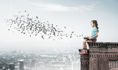 Concept of careless happy childhood with girl exploring this wor