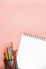 Creative workspace desk with notepaper,pencil in box on color background ,copy space, minimal style