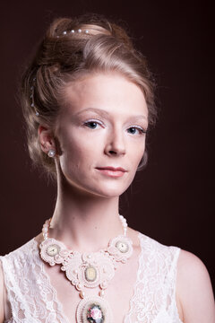 Gorgeous beautiful blonde woman in vintage victorian dress. Rich and vintage. Luxury and elegance. Studio photo