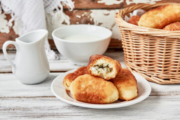 Russian pirozhki. Fried patties stuffed with rice, egg and dill,horizontal