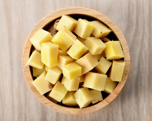 ginger sliced in wood bowl