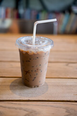 Iced mocha with straw in plastic cup