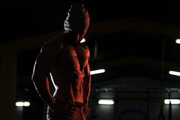 Fototapeta na wymiar Silhouette Bodybuilder Flexing Muscles