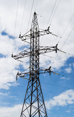 High voltage power electricity pylons on sky background