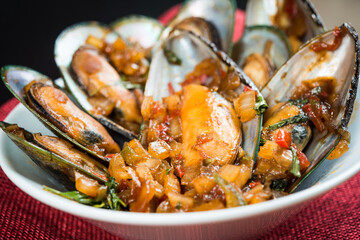 Mussel with white wine sauce on table