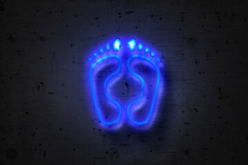 Foot imprint, neon sign on concrete wall