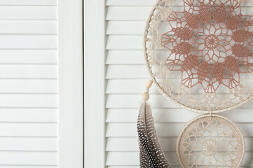 Beige brown dream catcher on door