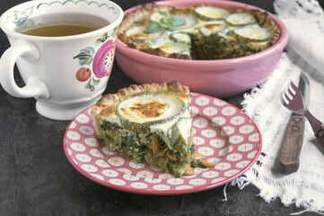 rustic pie with zucchini, on a black background