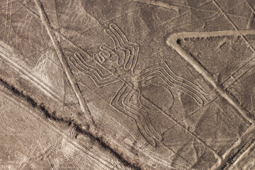 Aerial view of geoglyphs near Nazca - famous Nazca Lines, Peru. In the center, Spider figure is...
