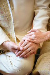 wedding rings together in hands