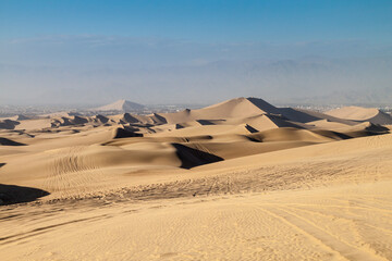 Fototapeta na wymiar Sand dunes in Huacachina desert, Ica Region, Peru