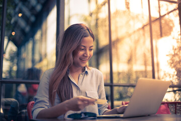 Asian woman working in coffee shop cafe