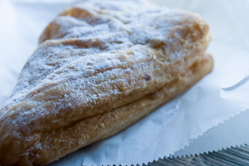 Puff with sugar powder and filling