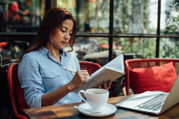 Asian woman working in coffee shop cafe