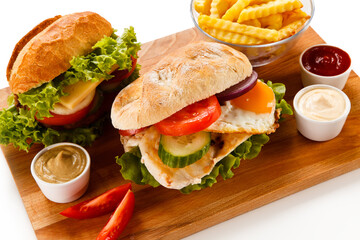 Sandwich with chicken fillet and fried egg 