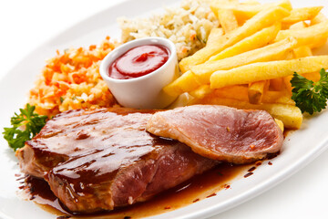 Grilled steak with french fries on white background 