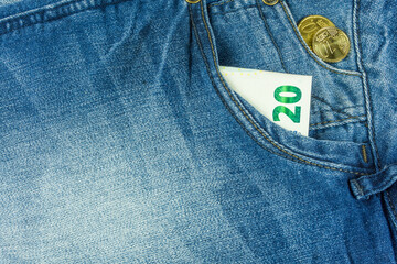 Jeans in blue with money in pocket