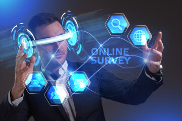 Business, Technology, Internet and network concept. Young businessman working in virtual reality glasses sees the inscription: Online survey