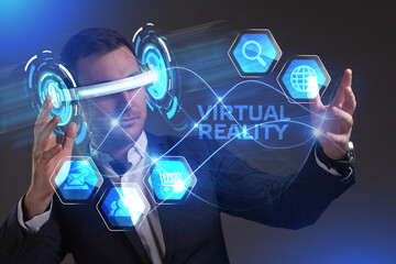 Business, Technology, Internet and network concept. Young businessman working in virtual reality glasses sees the inscription: Virtual reality