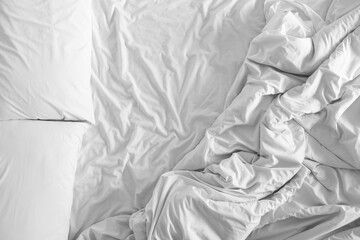 Bed sheets and pillows messed up after nights sleep ,comfort and bedding concept in a hotel room, concept travel and vacation